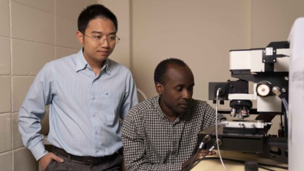 A photograph of Dr Hieu Nguyen and PhD candidate Mike Tebyetekerwa in the lab.