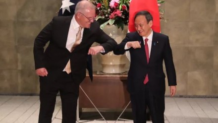 Scott Morrison and Japanese PM  Yoshihide Suga elbow-bump in greeting.