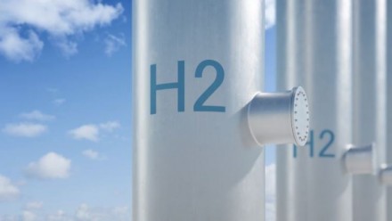 A photograph of a pole with &#039;H2&#039; written on it, with a blue sky behind.