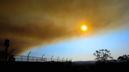 The sun seen through a cloud of smoke.