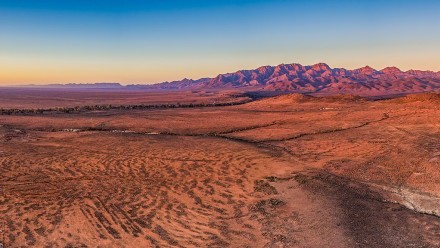 Australian desert w/ mountain range - sunset
