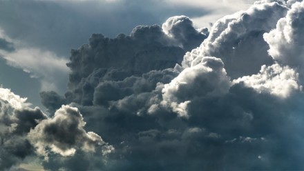 A photograph of building storm clouds.