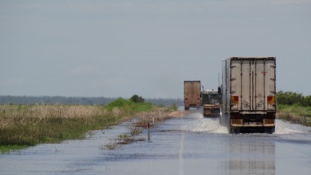Trucks driving through floods
