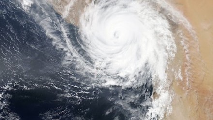 An aerial photograph of the clouds forming the typical cyclone swirl.