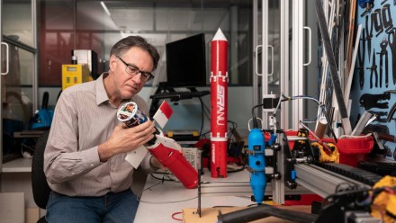 ANU Professor Robert Mahony, who specialises in aerial robotics, with a scaled-down prototype of his autonomous aerial water glider. 
