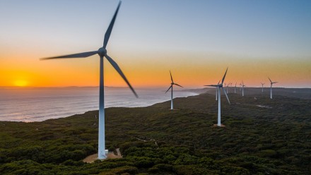 Wind turbines near the coast, sunset.