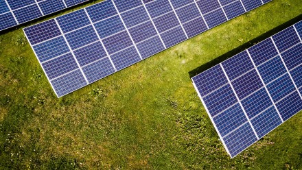 Aerial view of solar panels on grass