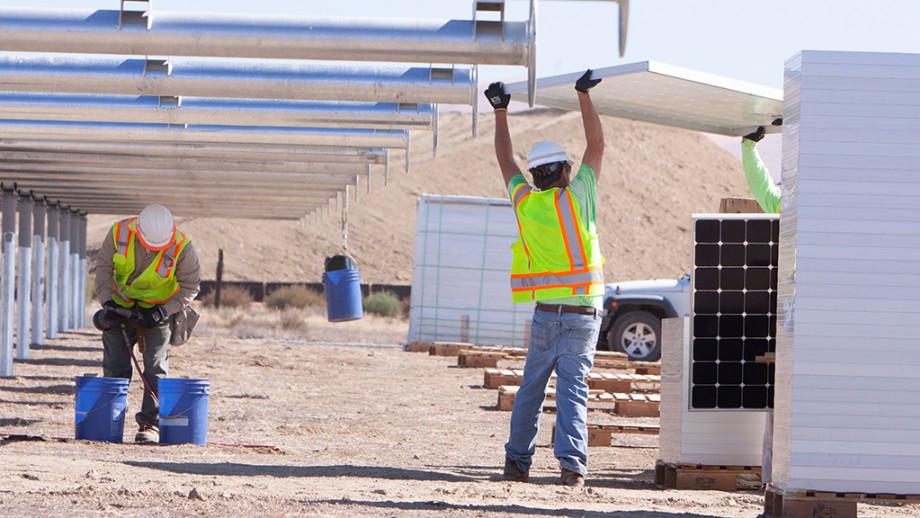 Workers building a Solar Farm