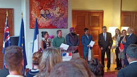 Adriana Luga, Grégoire Davignon, Md Morshed Alam and Sourav Ghosh standing up receiving their awards as the winning group at the Embassy of France to Australia.