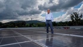 Photo of Prof Andrew Blakers next to solar panels